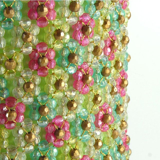 Atmospheric table lamp from the 1970s. The base is made of gold-coloured metal. The eye-catching lampshade is entirely...