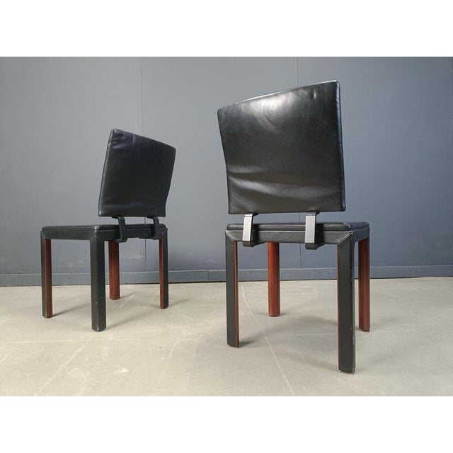 Set of 6 postmodern dining chairs by Durlet feauturing an elegant high quality leather and wooden frame and a black...