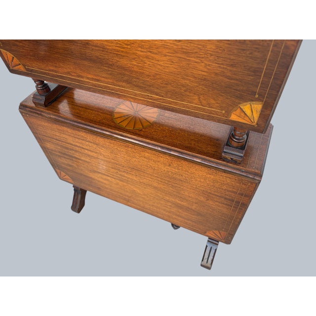 A very rare Georgian style Inlaid 2 Tier Drop Leaf Table. A Rosewood Folding Table Inlaid with shell designs on two...