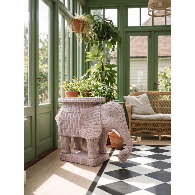 A rare sculptural rattan side table depicting an elephant, in the spirit of the iconic creations of the Italian company...