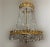 Italian rock crystal empire style chandelier. 60's. Original finish in gold leaf on bronze. Six bulbs Up to 250V...