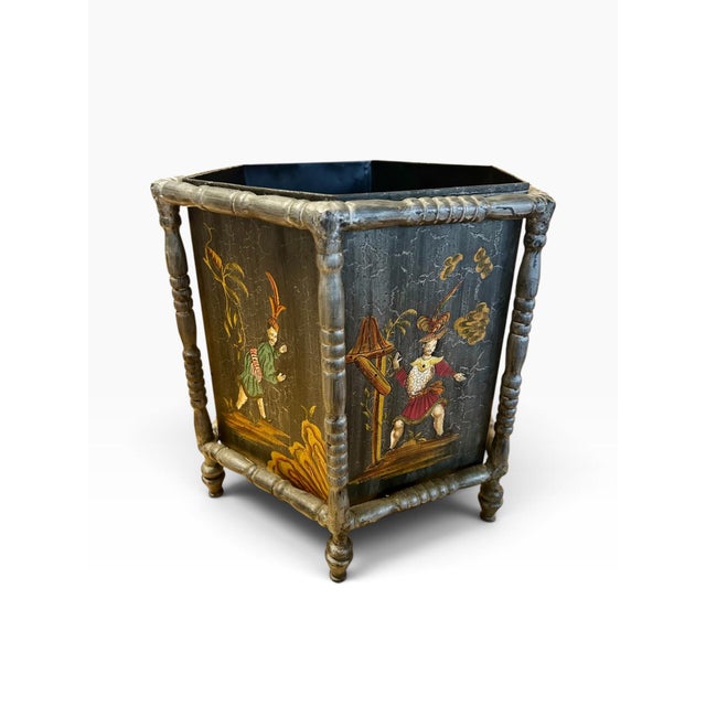 This is a gorgeous painted metal wastebasket. Its a hexagon shape and sits in a worn green six leg holder. It would be...
