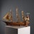 Hand-built wooden sailing ship. This piece is attributed to the mentioned designer/maker. It has no attribution mark and...