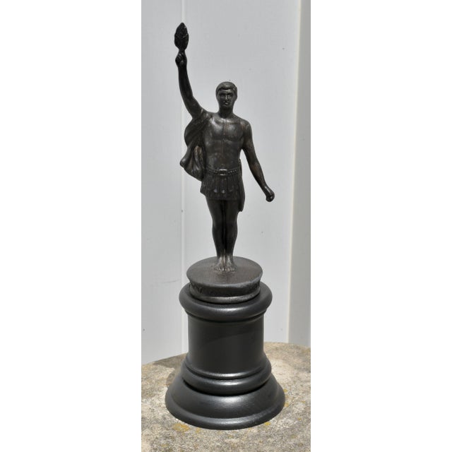 Vintage (1950's) Statue of an Olympian Man. Made of Metal with a Wood Base. Bronzed Color. The Measurements: 4.5"Diam. x...