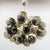 Italian oval shaped sputnik chandelier with 24 smoky Murano glass globes mounted on brass frame in unlacquered natural...