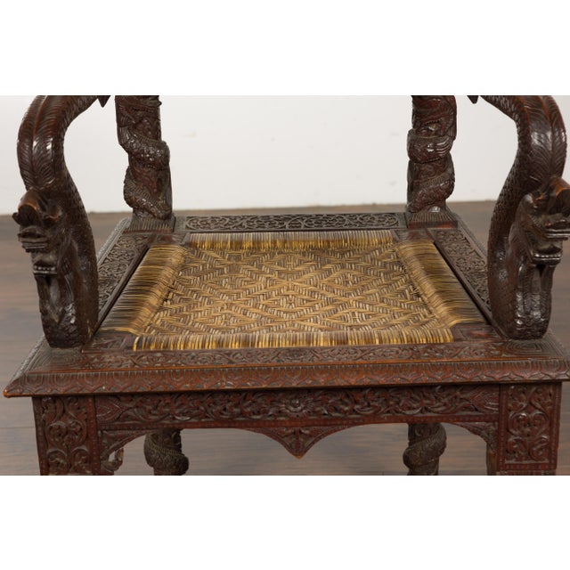 Wood Anglo-Indian 1900 Armchair with Carved Back, Mythical Creatures and Woven Rattan For Sale - Image 7 of 12