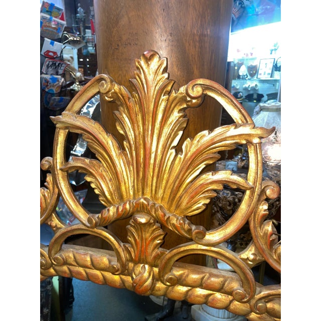 This antique mirror is an exquisite piece that will add a touch of elegance to any room. The frame is made of wood and...