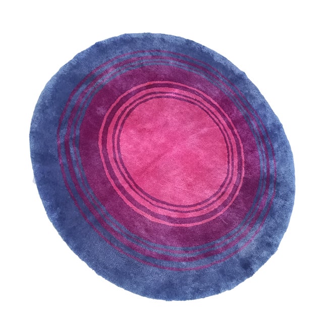 Pop art wool rug designed by Edwald Kroner. This soft and cozy rug features a graphic target pattern in a modern palette...
