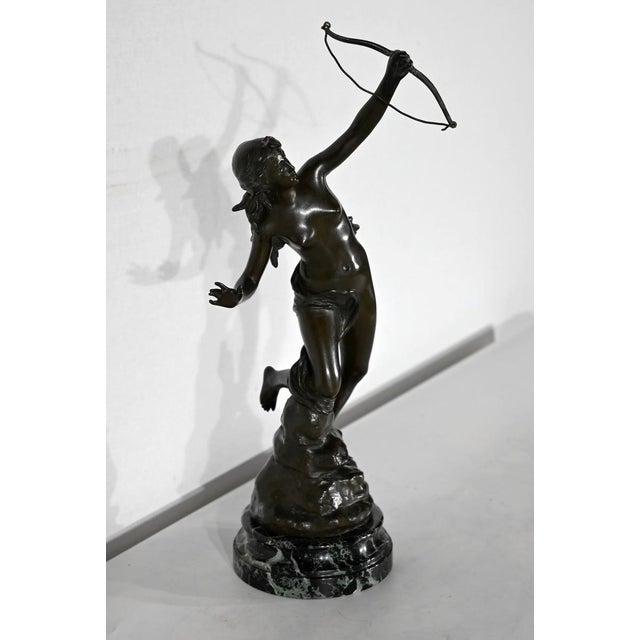 Bronze with dark brown patina, on sea green marble base, signed J. Garnier on the terrace. Jean Garnier (1853 - 1910), is...