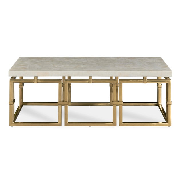 This beautiful statement cocktail table was inspired by classic jewelry links. Open cast brass fretwork base with a...