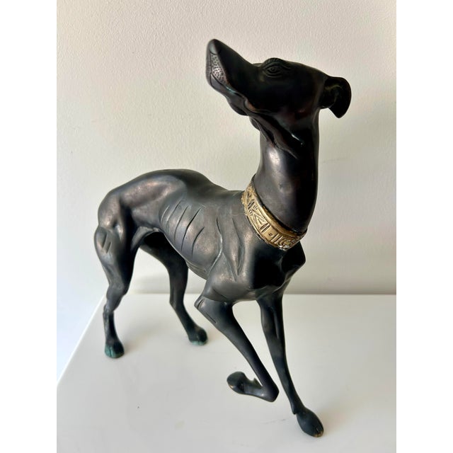 Fantastic brass sculpture of hunting dog, lots of movement in this pose, one leg up and curled tail. Attributed to the...