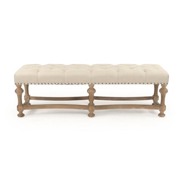 The Clair Bench from Zentique is a generously proportioned entryway or bedroom bench with a button-tufted natural linen...