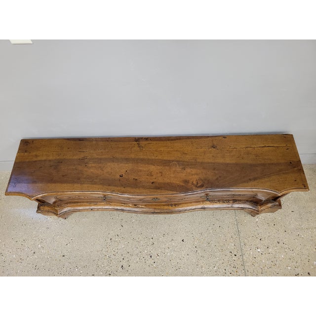 A very unique bench that has a drawer. French provincial style with carved detail and original iron lock. (There is no...