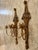 A lovely pair of Vintage French Rococo or Hollywood Regency style wall sconces with an elegant design. They have two gilt...