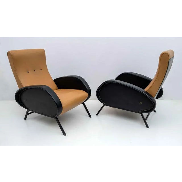 Pair of reclining armchairs designed by Marco Zanuso in the 1950s. The armchairs have their original eco-leather coating,...