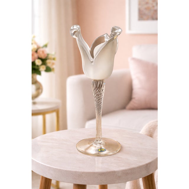 This striking art glass piece features a graceful tulip-inspired silhouette, blending sculptural beauty with refined...