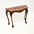 A lovely antique console side table in the Queen Anne style. This was made in England, it dates from around the 1930’s. It...