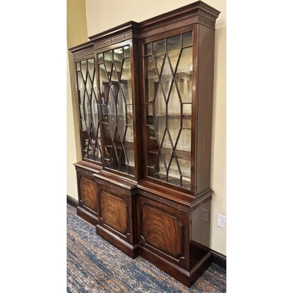 Beautiful mahogany English Chippendale or Georgian style breakfront china cabinet by Baker. I believe this was made in the...