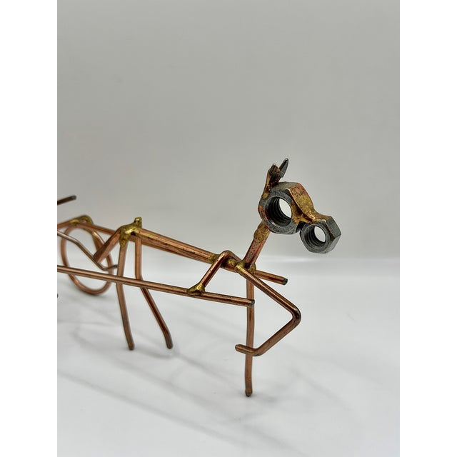 Vintage handmade wire horse and sulky sculpture with a wonderful linear, mid century inspired silhouette. This piece...
