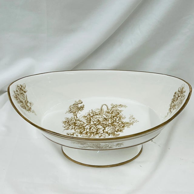 Italian oval center bowl with floral pattern on each of the outer sides and in the center and ends of the interior. Marked...