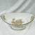 Italian oval center bowl with floral pattern on each of the outer sides and in the center and ends of the interior. Marked...