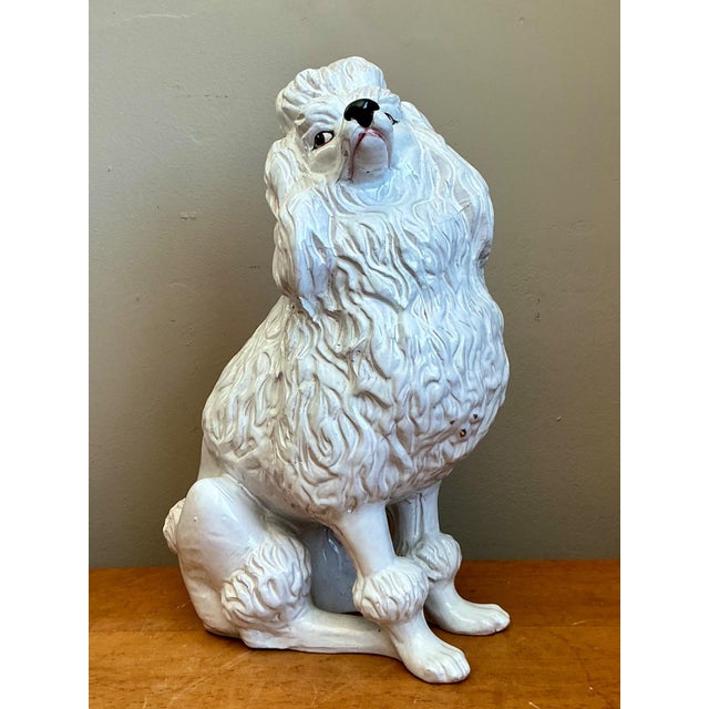 This vintage ceramic poodle sculpture channels the playful sophistication of mid-century Italian decorative arts. Rendered...