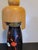 A tall vintage Japanese wood kokeshi doll. Lovely hand painted floral pattern. Nice two tone detailing with the blonde...