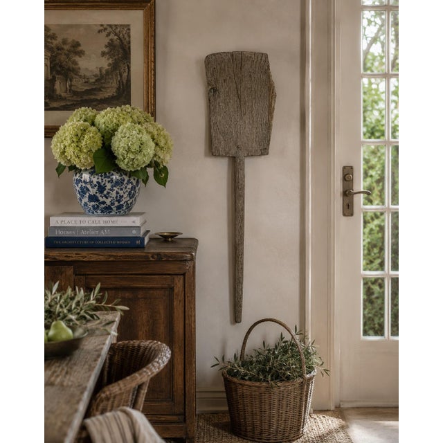A wonderfully sculptural late 19th century wooden grain shovel, hand-hewn with a beautifully weathered surface that only...