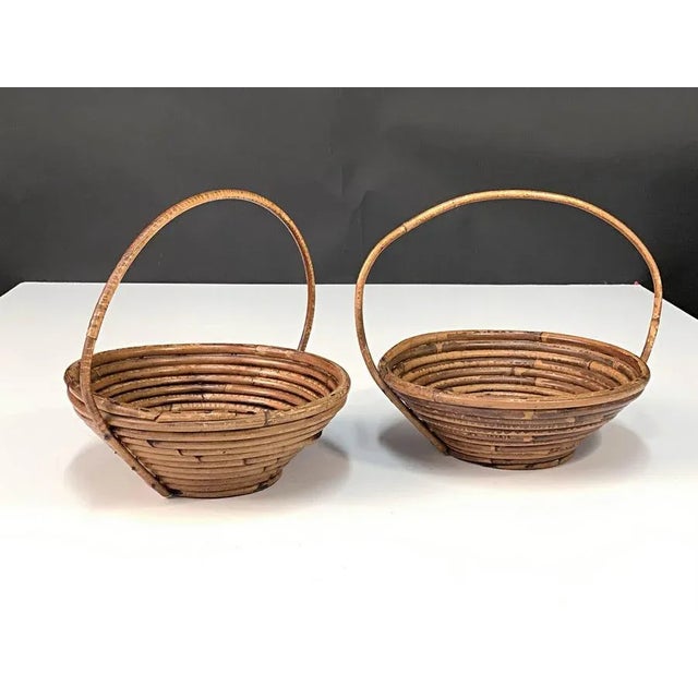 Pair of fantastic Mid-Century Modern decorative rattan and bamboo decorative bowls. These pieces were produced in Italy...