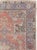 This mid-20th-century Turkish Anatolian accent rug presents a richly layered medallion composition across a muted coral...
