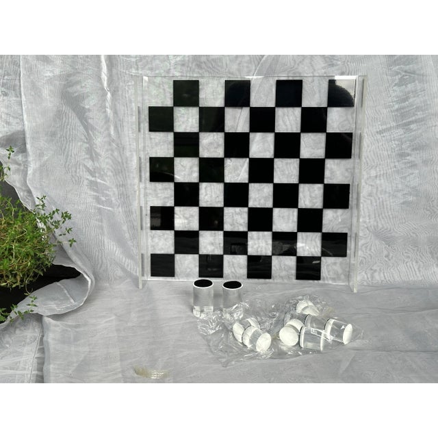 An amazing find, this vintage mid-century acrylic chess game set was never used and comes in its original packaging. The...