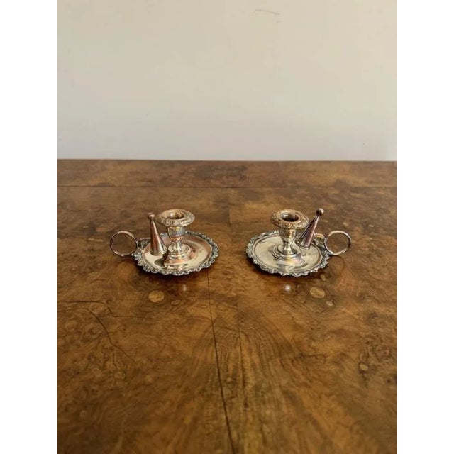 Lovely pair of antique George III silver plated chamber sticks having a quality pair of George III silver plated chamber...