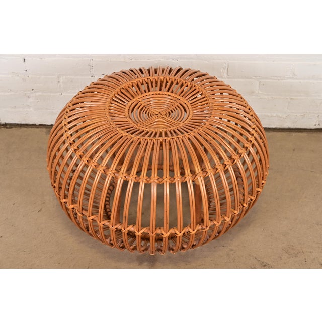 A gorgeous mid-century Organic Modern bent rattan pouf ottoman, footstool, or side table Designed by Franco Albini Italy,...