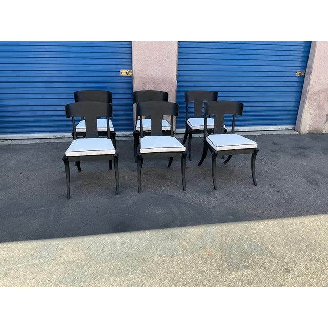 Modern patio Klismos style dining chairs. Set of 6 . The chairs are done in iron with a matte black finish. The chairs...