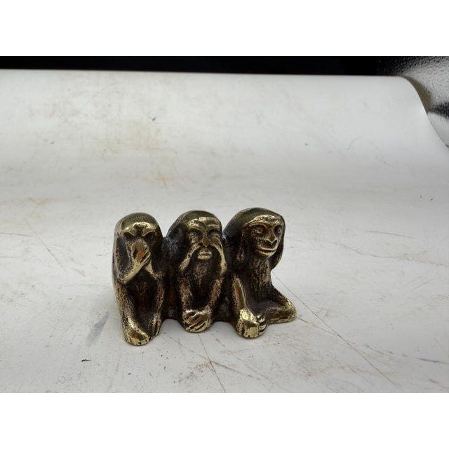 Solid cast brass figurine depicting the 'Three Wise Monkeys' symbolizing 'See no evil, Hear no evil, Speak no evil.' It...
