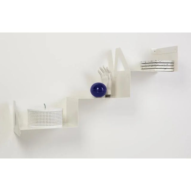 Cloud steps shelf by ok design dimensions: d 24 x w 96 x h 52 cm. Materials: powder-coated metal. Cloud steps is a wall-...