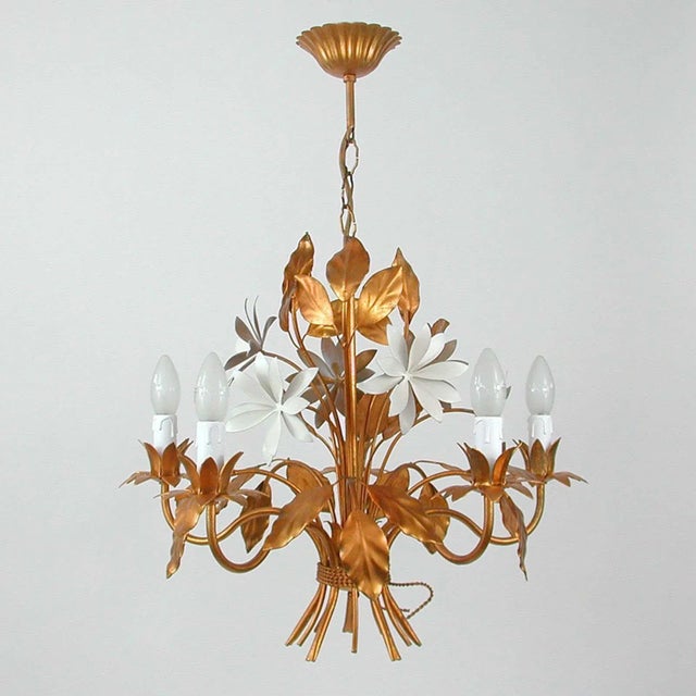 This beautiful gilt chandelier was designed and manufactured in Germany in the 1970s by Hans Kögl Leuchten. It features 5...