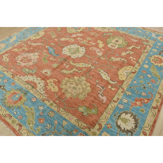 A modern traditional Anatolia rug hand-knotted with fine wool on a cotton foundation. This oriental rug features a...