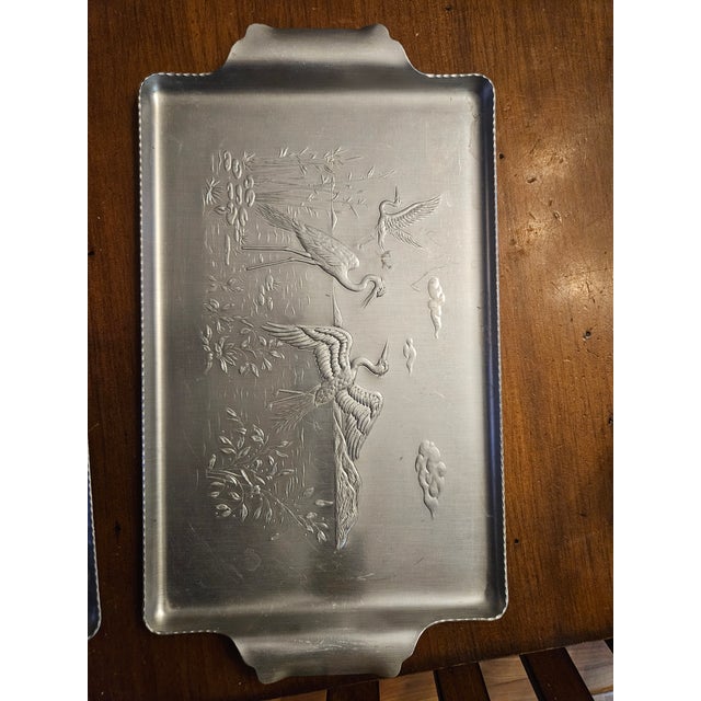 Beautiful pair of Admiration Products of NY Hammered Aluminum Serving Trays. One decorated with Cranes in a Wetland...