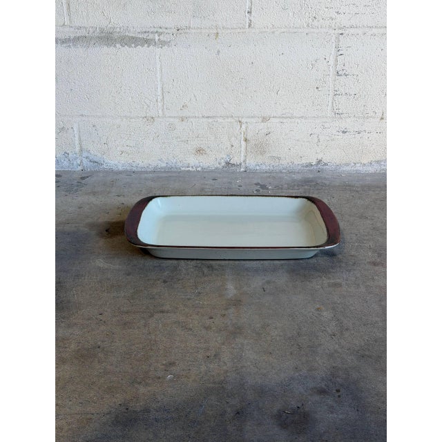 This large rectangular ceramic baking dish or serving platter offers a beautifully functional slice of classic Danish...