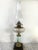 Gorgeous antique late 19th century hand painted glass oil lamp in working condition.