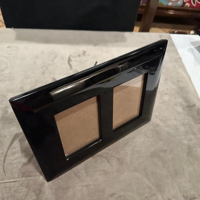 An high quality 1990s Modern Black Lacquered Wood Italian Design Double Picture Frame by Bussolari. Add a bold pop of...