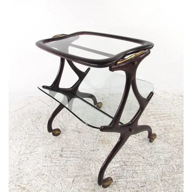 This beautiful Italian magazine cart features the unique sculptural Italian design of Cesare Lacca and makes a stunning...