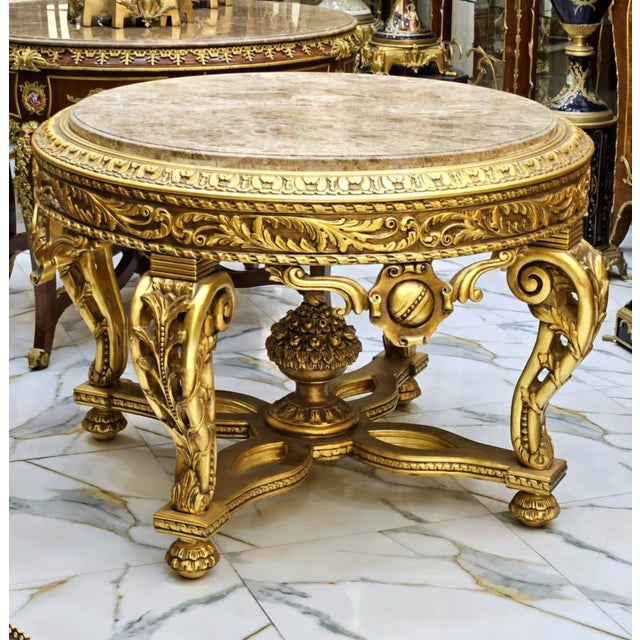 Elevate your space with this stunning Victorian French style center table, fully finished in rich gold leaf for a...