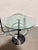 Coffee table by Alberto Danese for Cattelan Italia, black lacquered iron structure with black marble base and round...