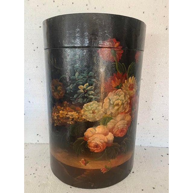 Painted half-moon shaped box Floral motif decoration on a black background Good condition Dimensions: H 60 x W 40 x D 29...