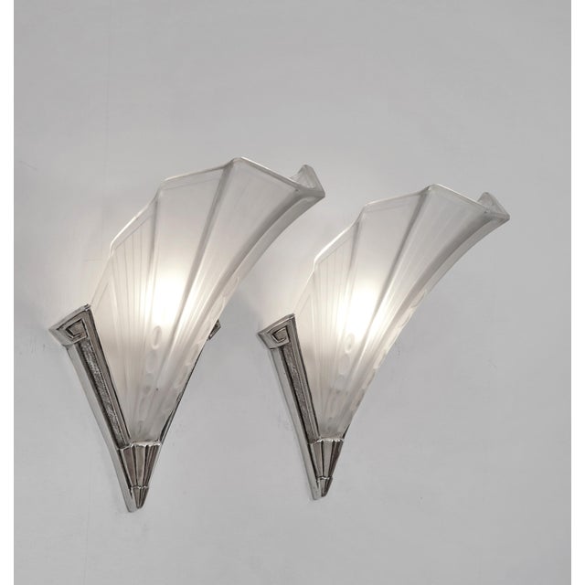 Etablissement Jean Gauthier A rare pair of large French art deco wall sconces made around 1925-1935. Nickel plated solid...