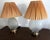 Very groovy and retro, this pair of table lamps features a frosted glass urn in a molded seashell form on polished brass...