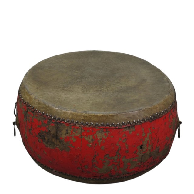 This antique Chinese drum features rich well aged patina and texture. A unique piece adds a touch of cultural charm to any...