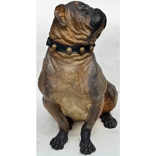 A soulful 19th century English terracotta bulldog, complete with glass eyes and a studded collar. Its subtly textured coat...